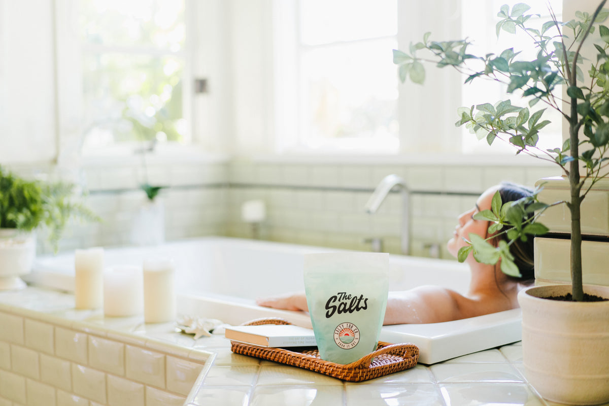 A Salty Tub soak set up beside the bath